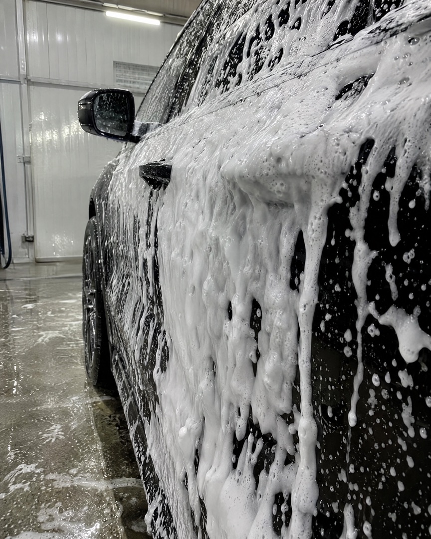 Snow foam on a black car