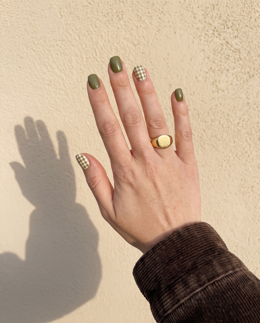 Olive gingham accent nails against a sunlit wall