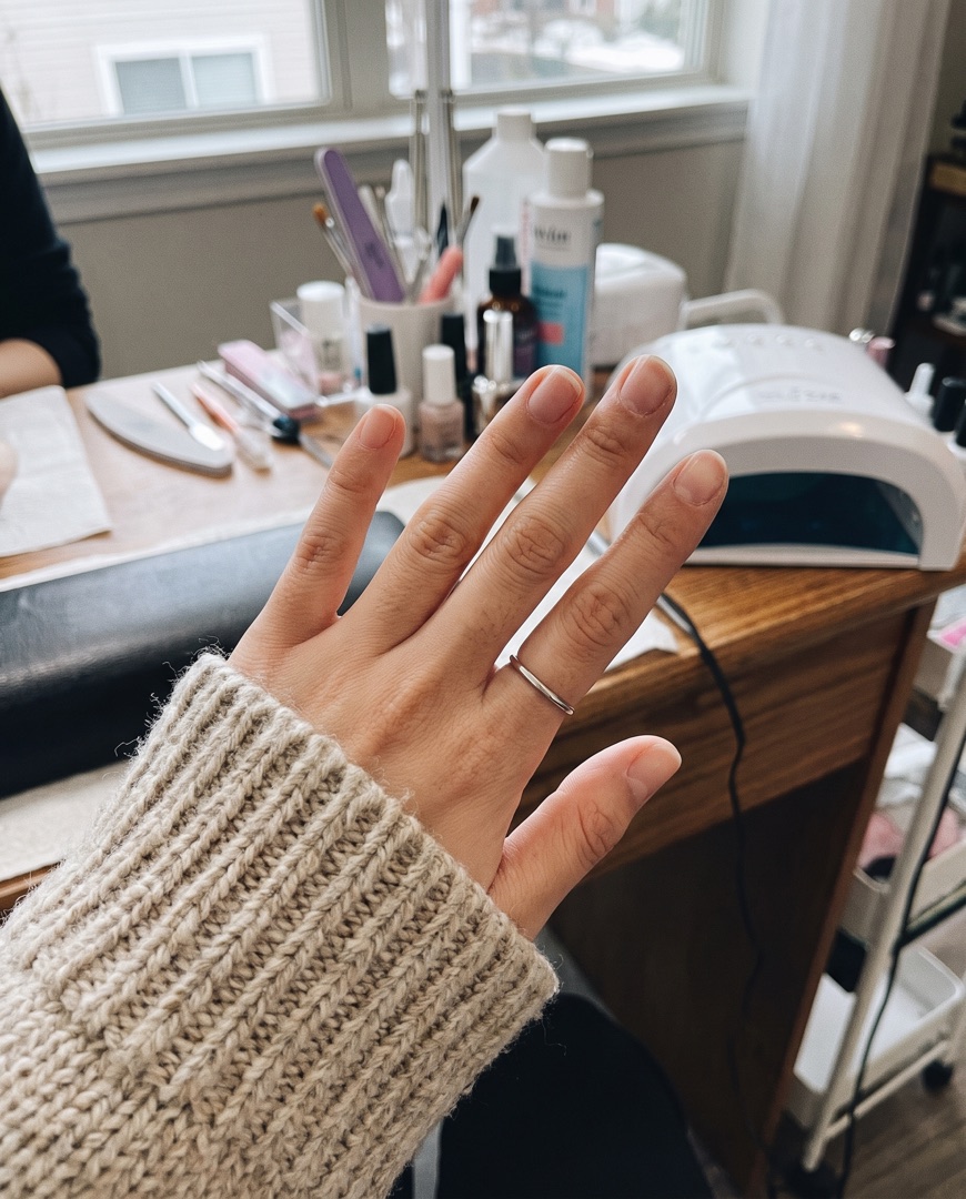 Client's natural nails on the salon table
